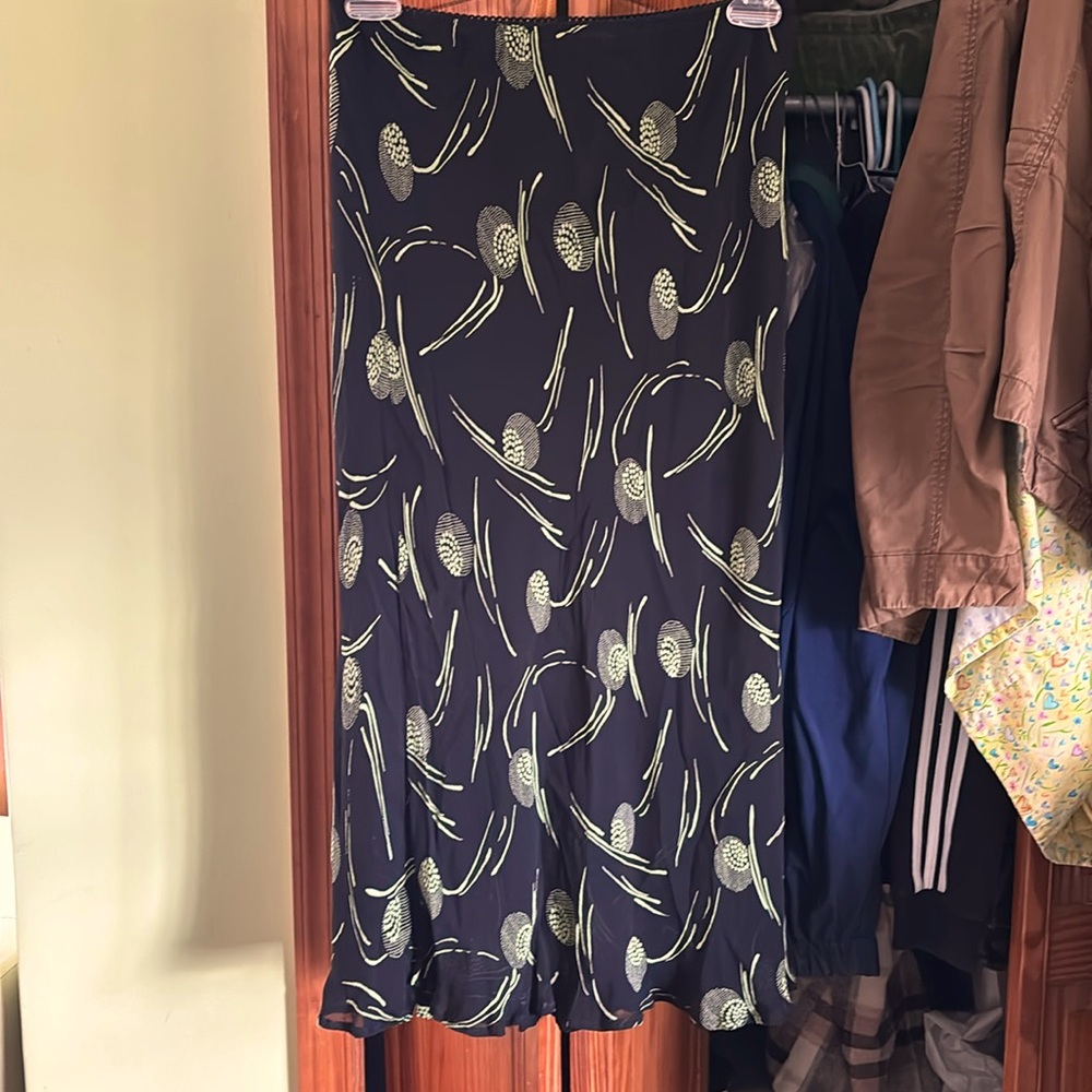 Chiffon skirt with lace slip underneath.little lace belt type covering on waist.